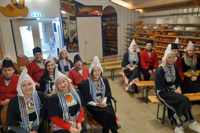 Dutch Experience in Volendam with Traditional Outfits - Inside Simonehoeve: Dutch costume, wooden shoes, and the pro group photo