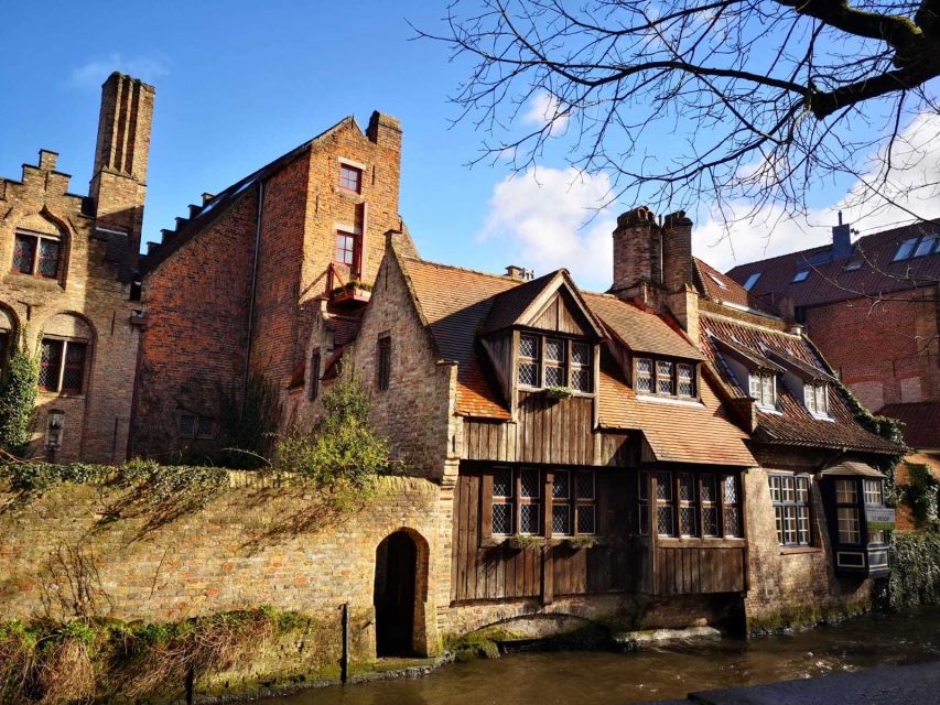 From Amsterdam: Bruges Day Trip in Spanish with Boat Option - Bruges Squares and Sights: Burg Square, the Grote Markt, and the Belfort Feel