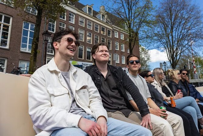 Highlights and Local Insights Canal Cruise Tour in Amsterdam - Red Light District on the water: Oude Kerk, neon lights, and Mini Venice