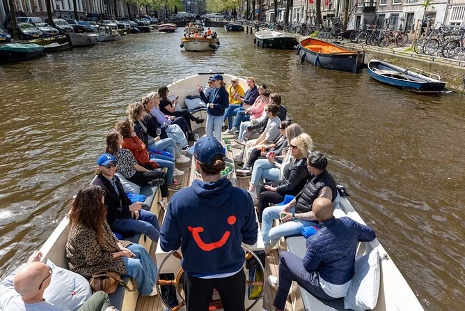 Highlights and Local Insights Canal Cruise Tour in Amsterdam - Under the Magere Brug: finishing with a classic bridge moment