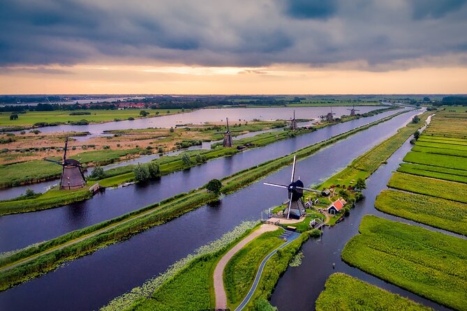 Kinderdijk Windmills and Delft Small-Group Tour from Amsterdam - World Heritage Kinderdijk: Windmills That Keep Feet Dry