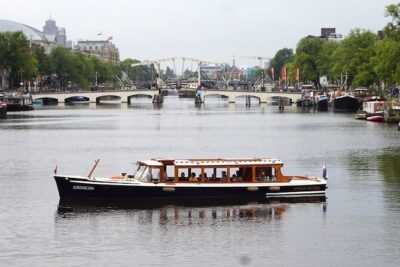 Morning Canal Cruise Amsterdam in Small-Group - The 1928 saloon boat: dry seating, warm blankets, and windows you’ll understand