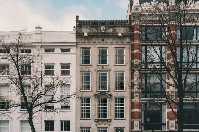Personalized Hidden Gems of Amsterdam Private Tour with a Local - St. Nicholas Basilica Area, Old Buildings, and the Wooden House Story