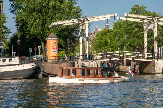 Private Boat Tour Amsterdam - 90 Min incl. welcome drink on historic saloon boat - Entering Amsterdam by Water: Why This Tour Feels Personal