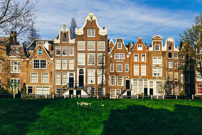 Private City Kickstart Tour: Amsterdam - St. Nicholas Church, Chinatown, and the Red Light District (With Context, Not Shock)