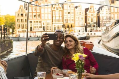 Private Romantic Canal Cruise Amsterdam with Bubbly and Snacks - From UNESCO Canals to the Skinny Bridge Kiss Spot