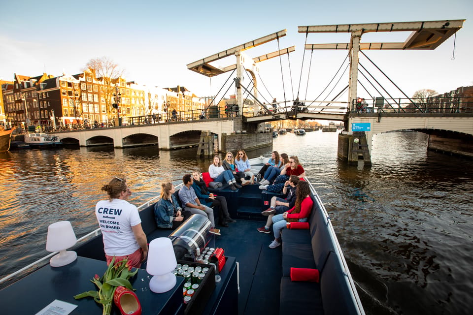 Small-Group Walking Tour with Amsterdam Canal Cruise - Standard Audio Cruise vs. Luxury Open Boat With Bar